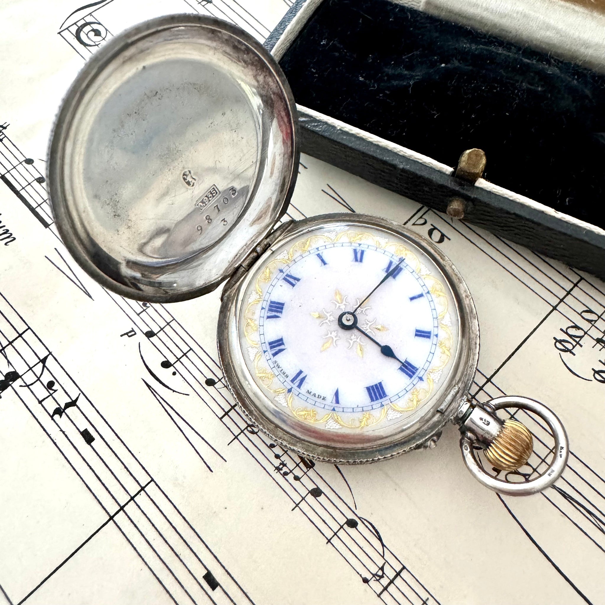 Victorian Swiss sterling silver ladies pocket watch on vintage sheet music and with a vintage jewellery box