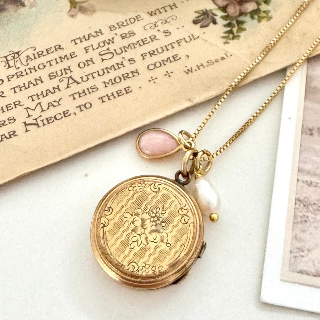 Vonk Jewellery 9ct gold back and front Edwardian locket with pearl and pink opal charms on vintage postcards