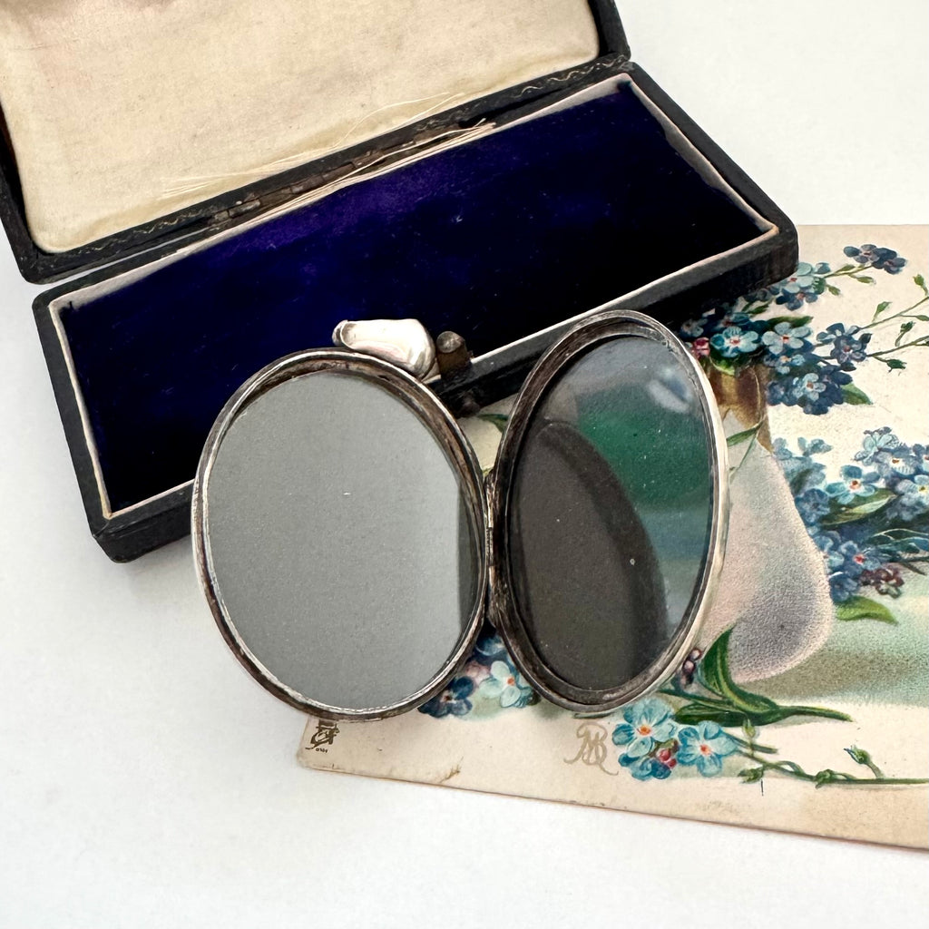 Antique 1879 sterling silver locket with engraved design in a box with floral card
