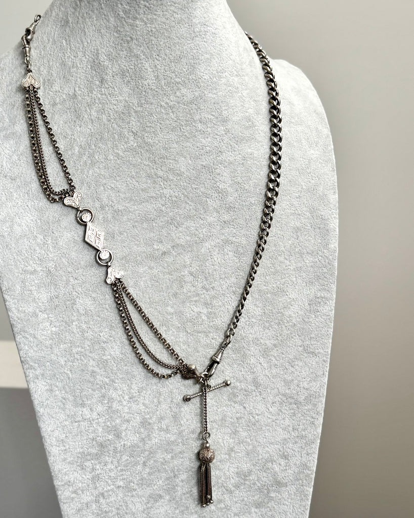 Antique Victorian continental silver triple strand Albertina watch chain with tassel on a grey mannequin