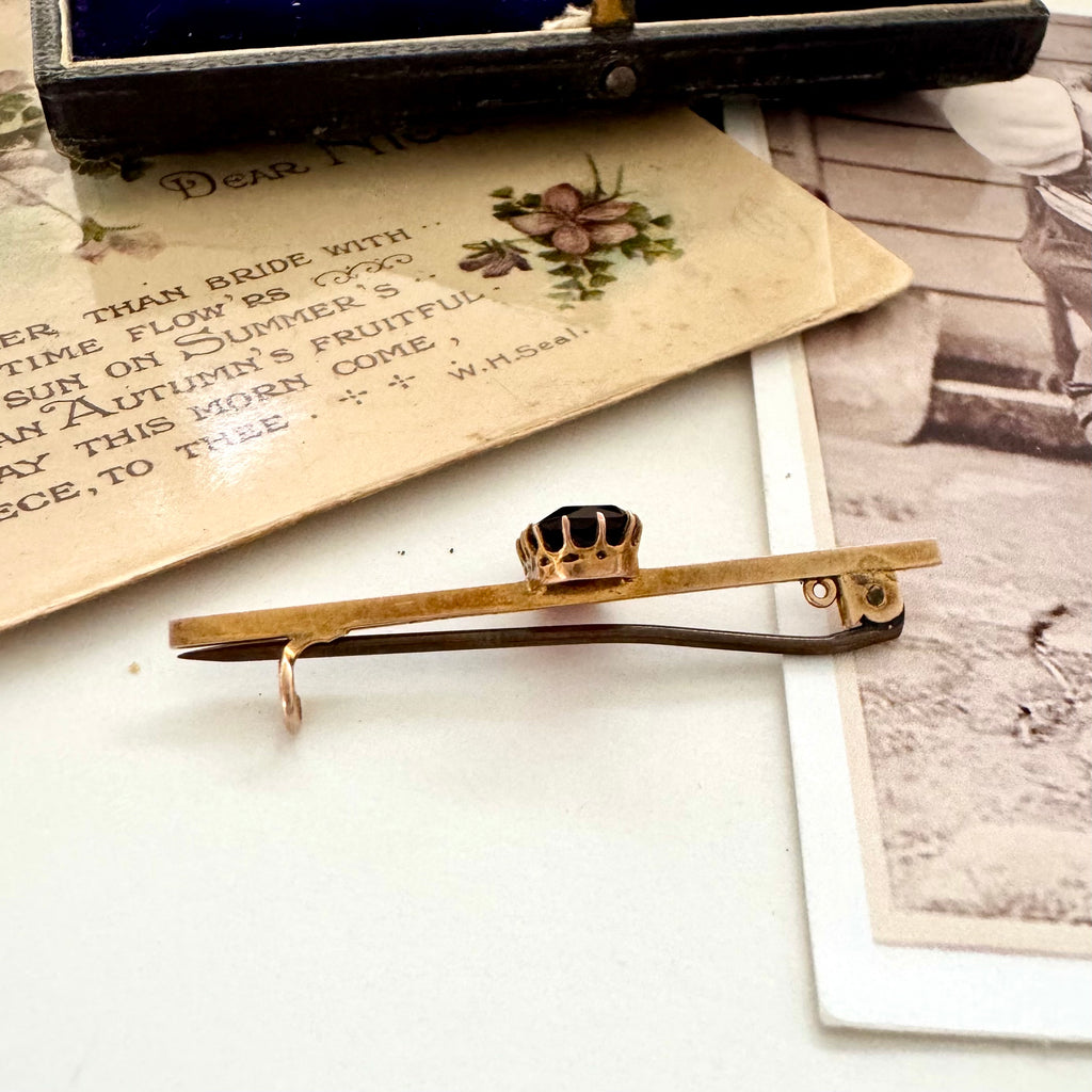 Vonk jewellery red paste stone 9ct gold bar brooch on a vintage photo and postcard