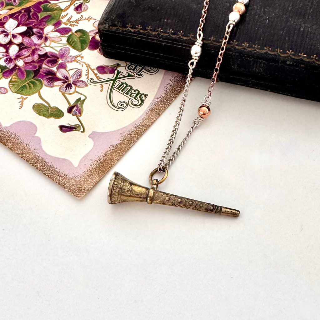 Antique gilt watch key necklace with a old jewellery box and vintage Christmas card