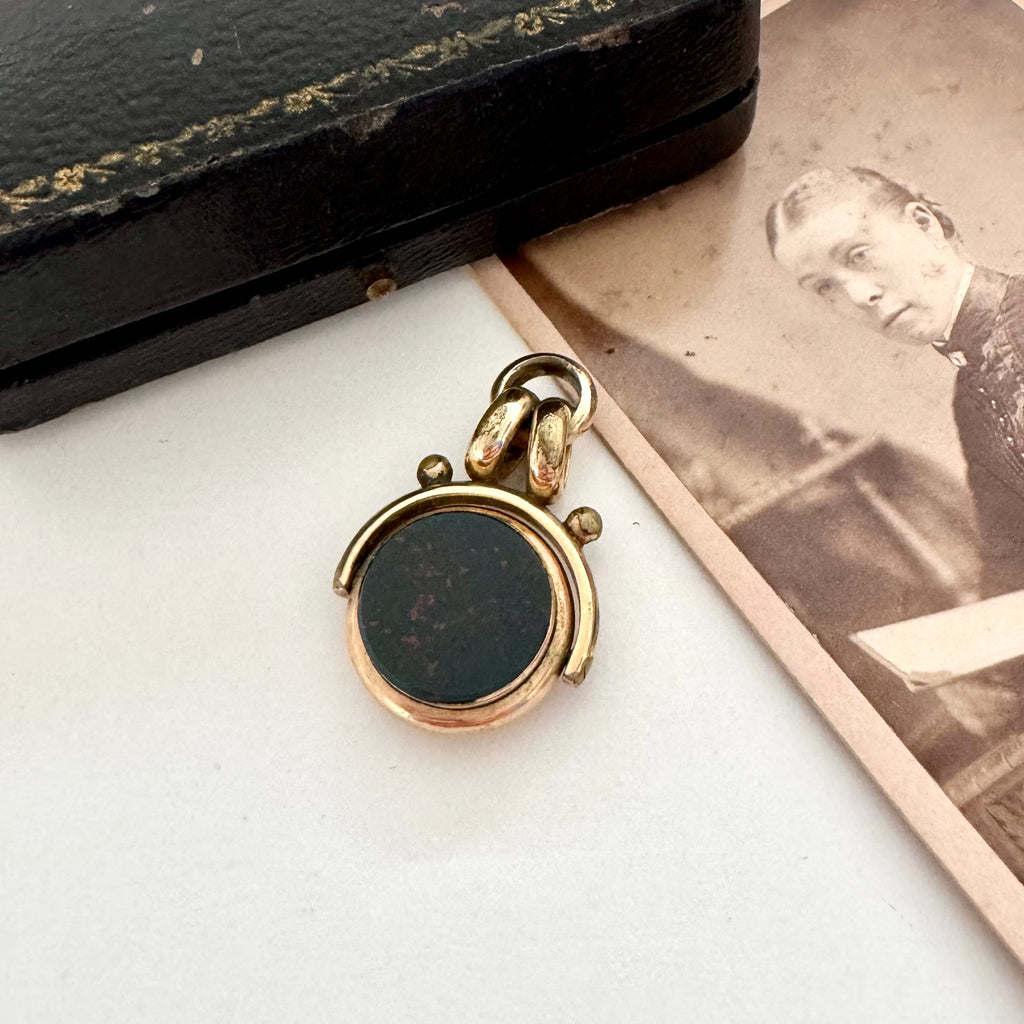 Antique carnelian and bloodstone rolled gold spinning fob with an old jewellery box and antique photo