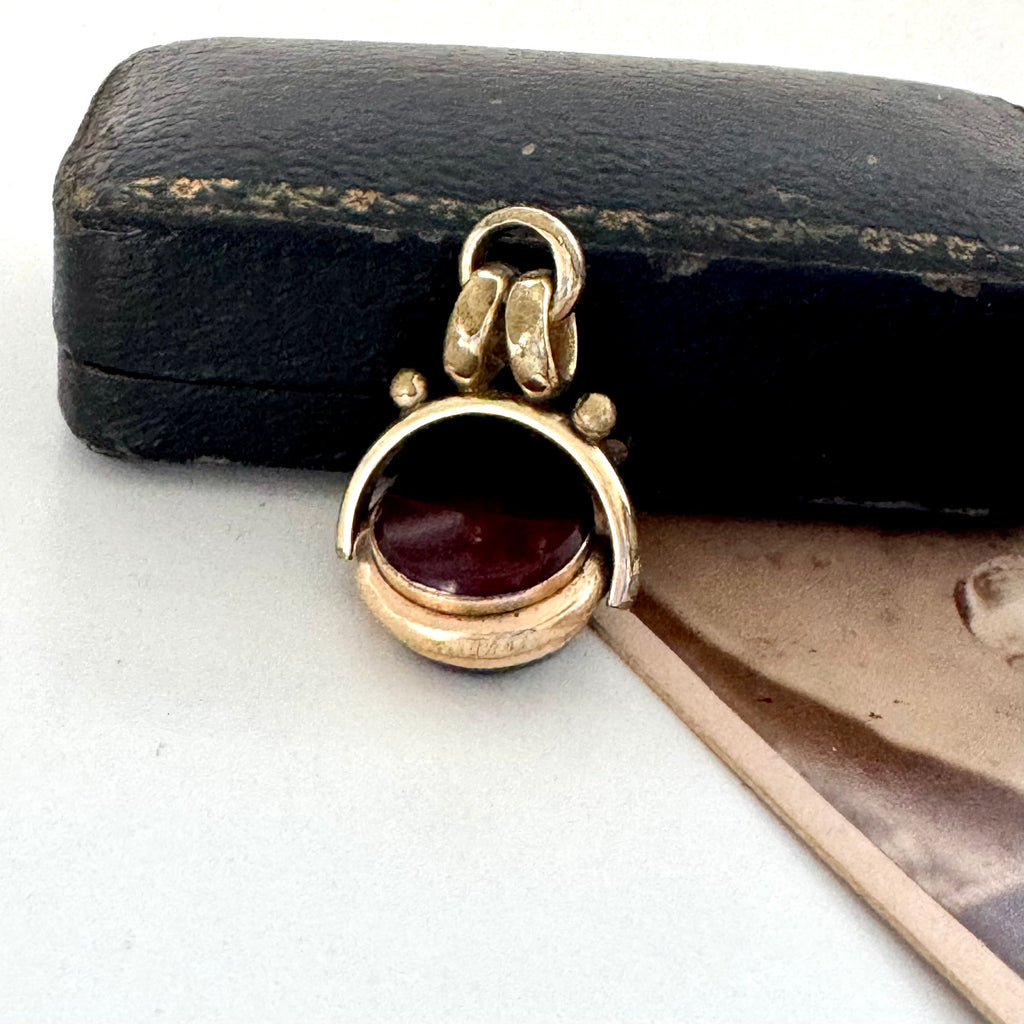 Antique carnelian and bloodstone rolled gold spinning fob with an old jewellery box and antique photo