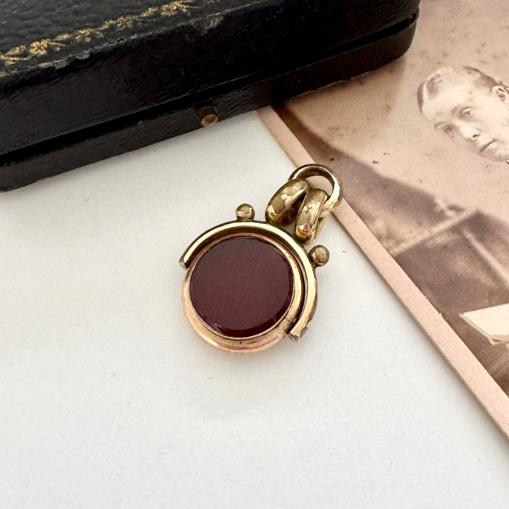 Antique carnelian and bloodstone rolled gold spinning fob with an old jewellery box and antique photo