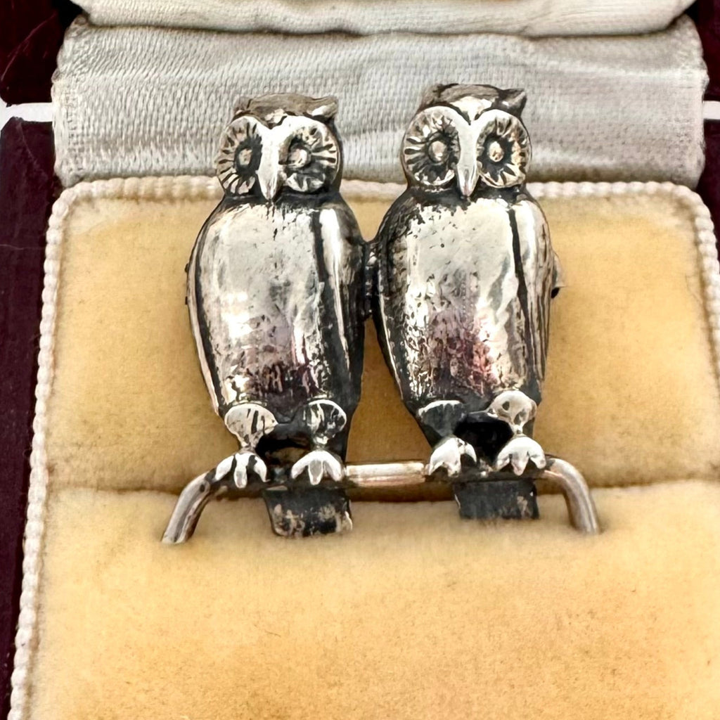 Antique silver owl brooch in a wooden box with 'Melbourne' branding.