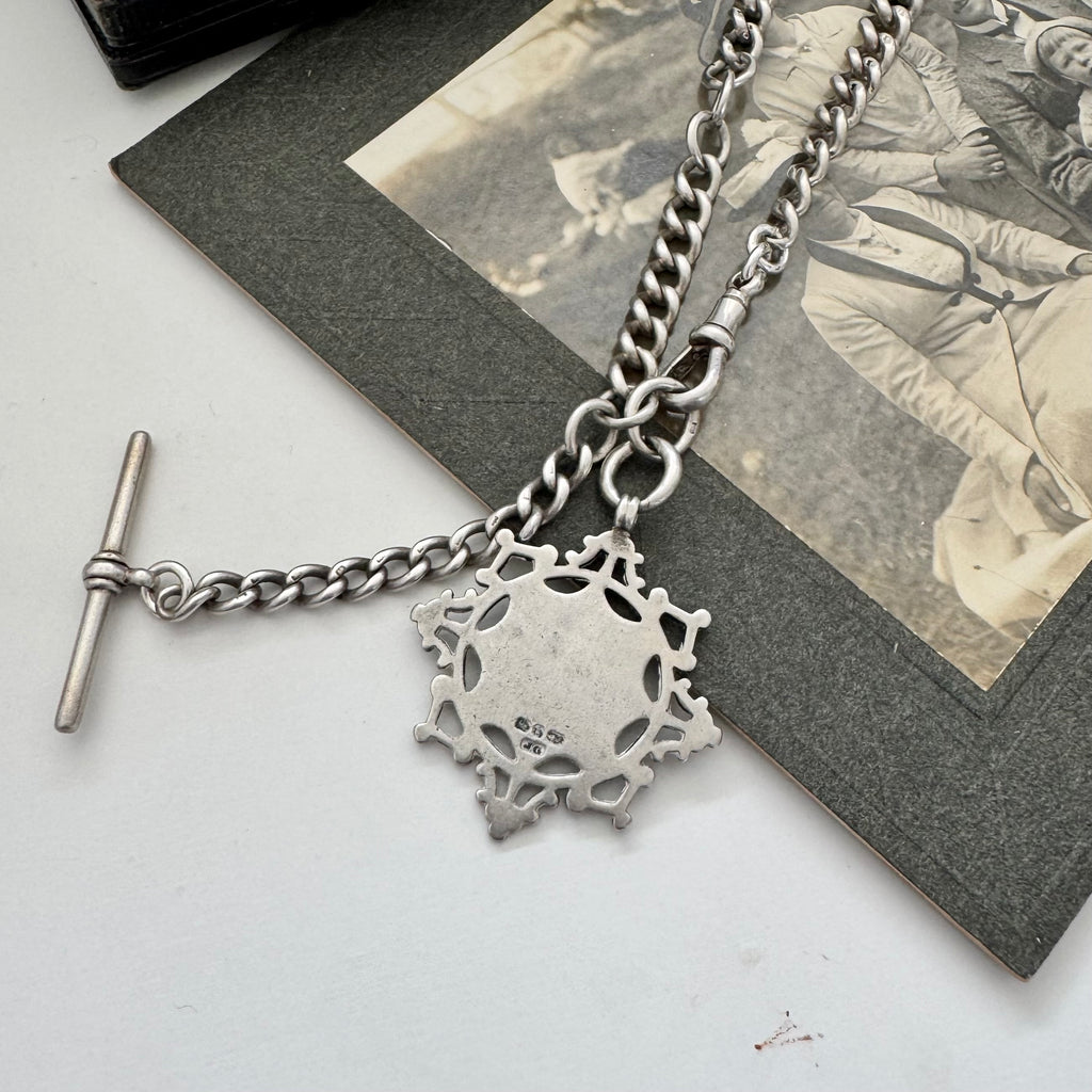 Antique silver albert watch chain and watch fob necklace with an albert clasp on a vintage-style card and jewellery box.