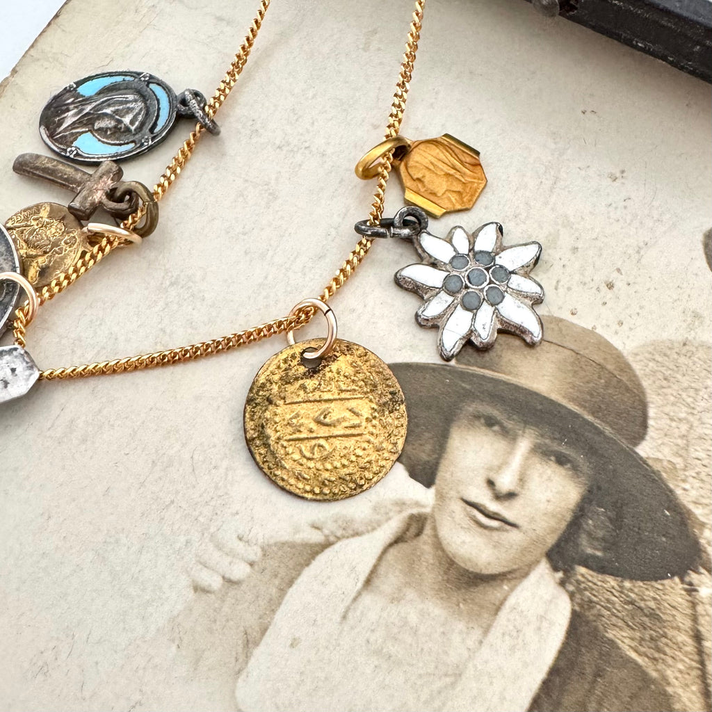 A vintage Egyptian charm on an old photo of a woman wearing a hat