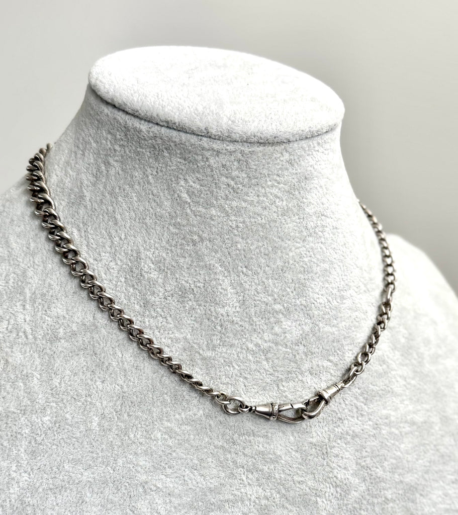 Edwardian sterling silver Albert watch chain on agrey mannequin