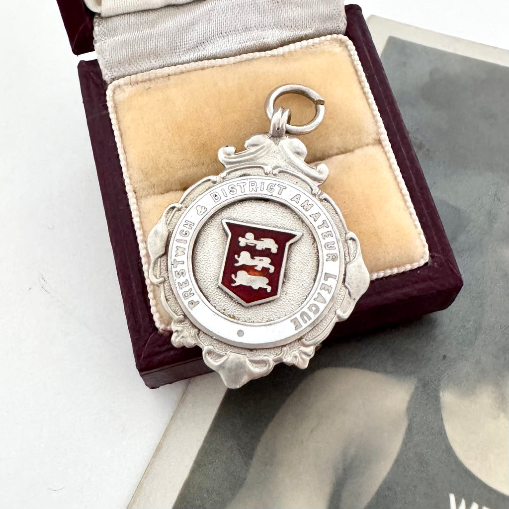 1929 Fattorini silver watch fob featuring the 3 Lions emblem for Lancashire on a beige cushion in a wooden box