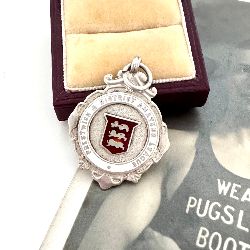 1929 Fattorini silver watch fob featuring the 3 Lions emblem for Lancashire on a beige cushion in a wooden box