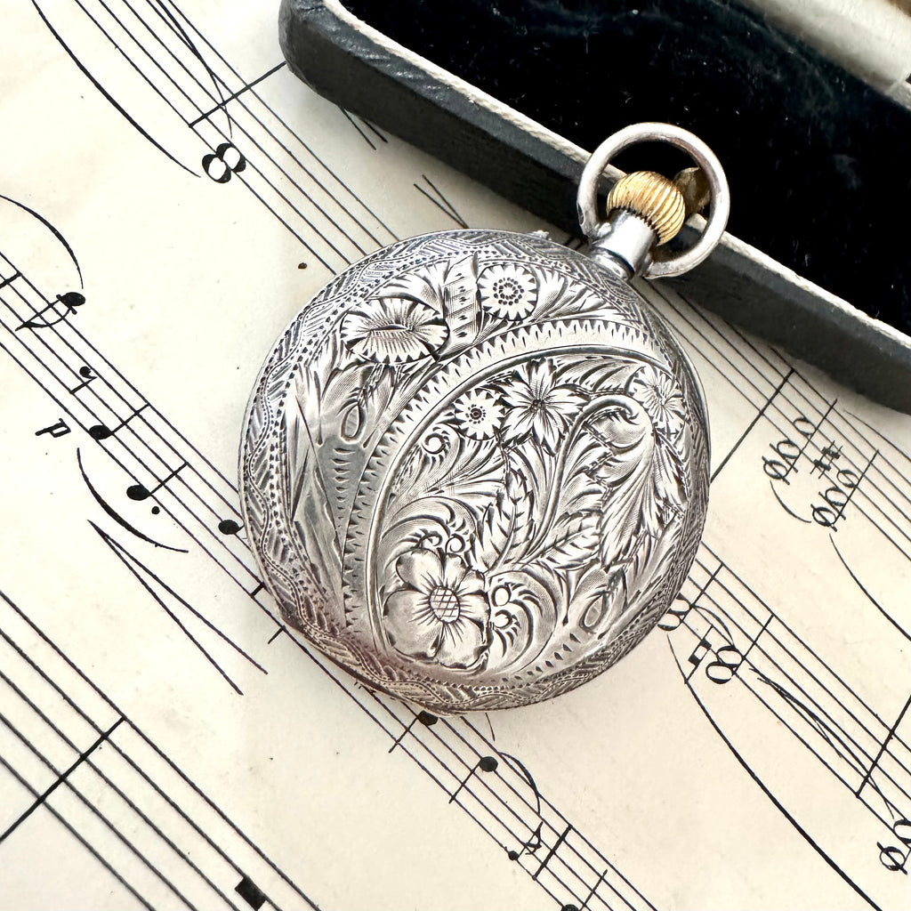 Vonk Jewellery antique Victorian Swiss silver ladies pocket watch on old sheet music