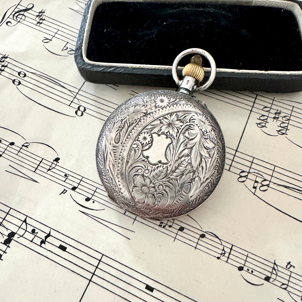 Vonk Jewellery antique Victorian Swiss silver ladies pocket watch on old sheet music