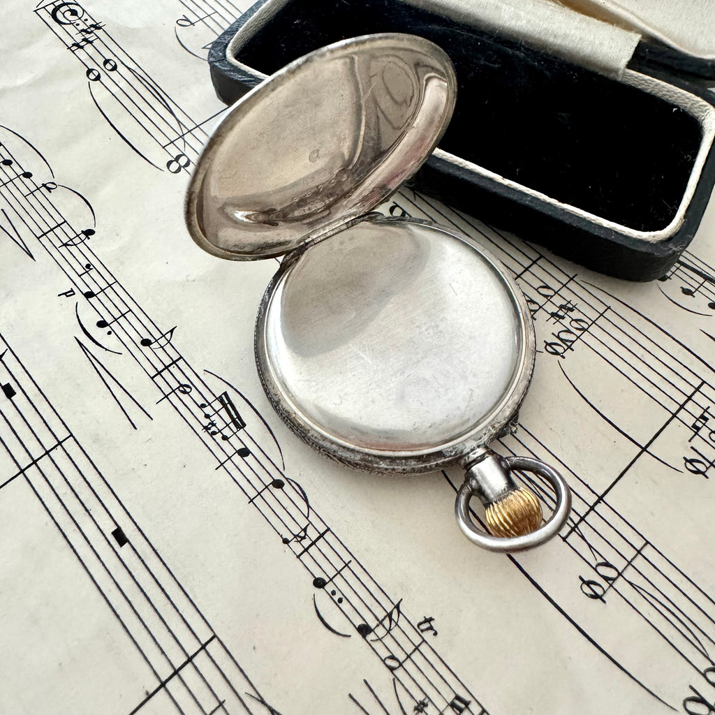Vonk Jewellery antique Victorian Swiss silver ladies pocket watch on old sheet music