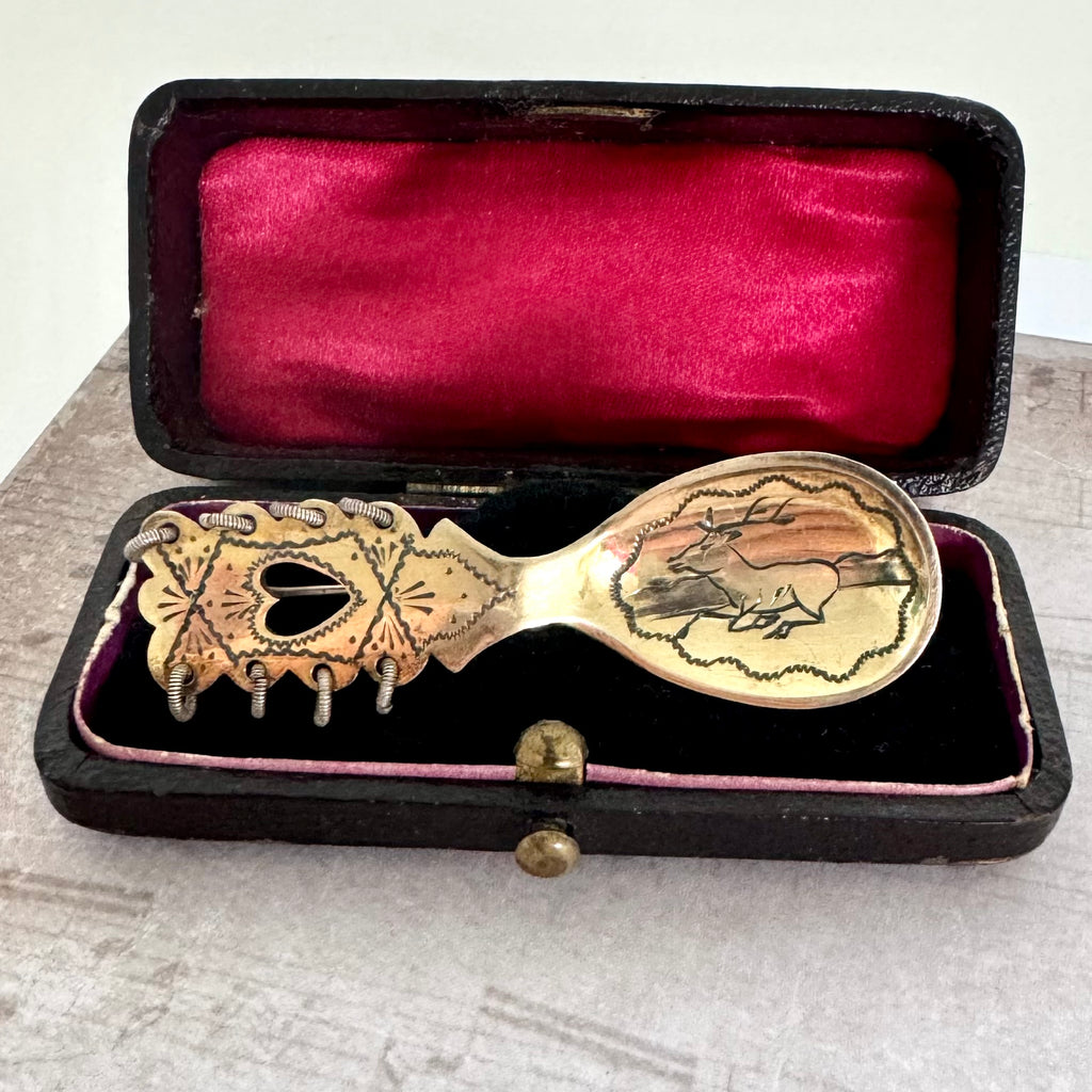 Decorative Swedish Sami spoon with intricate designs in a black case with red interior