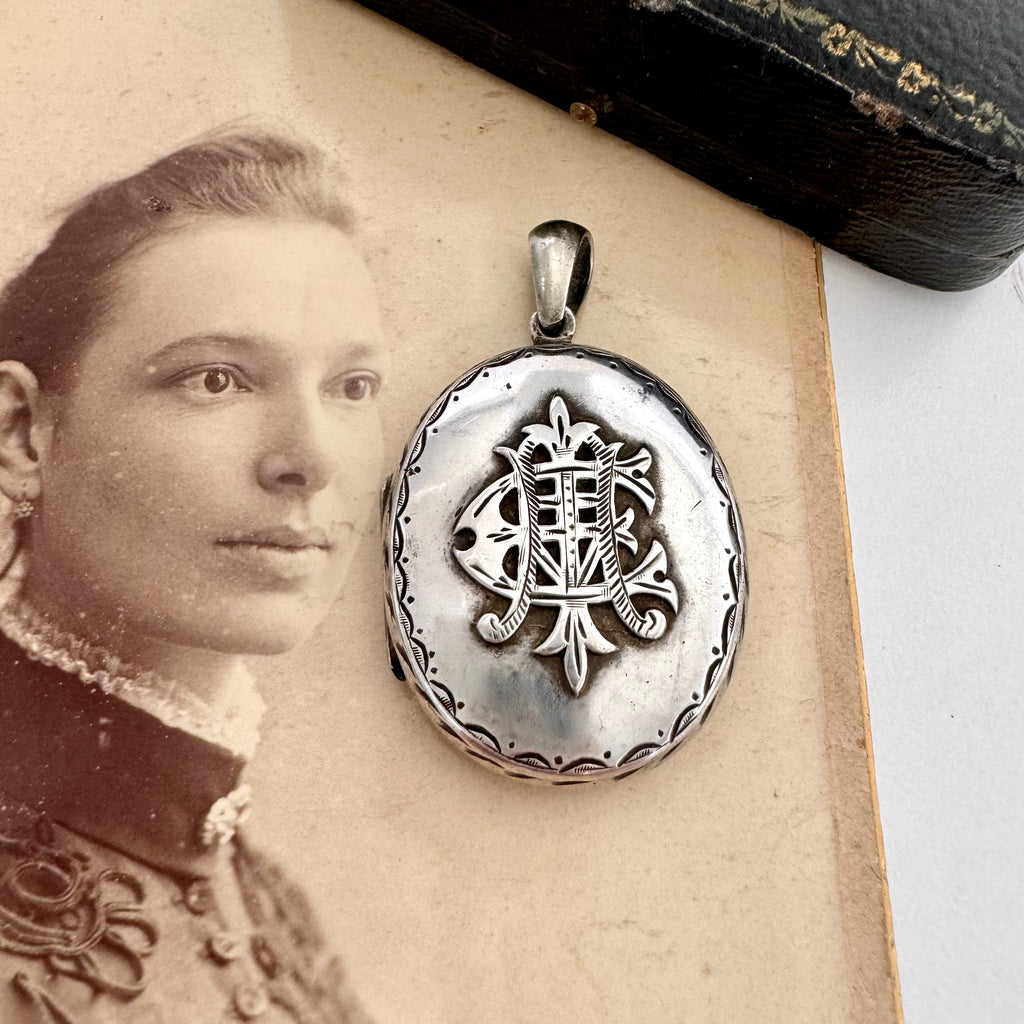 Vonk Jewellery Victorian silver Amity, Eternity and Infinity locket on an antique photo of a woman