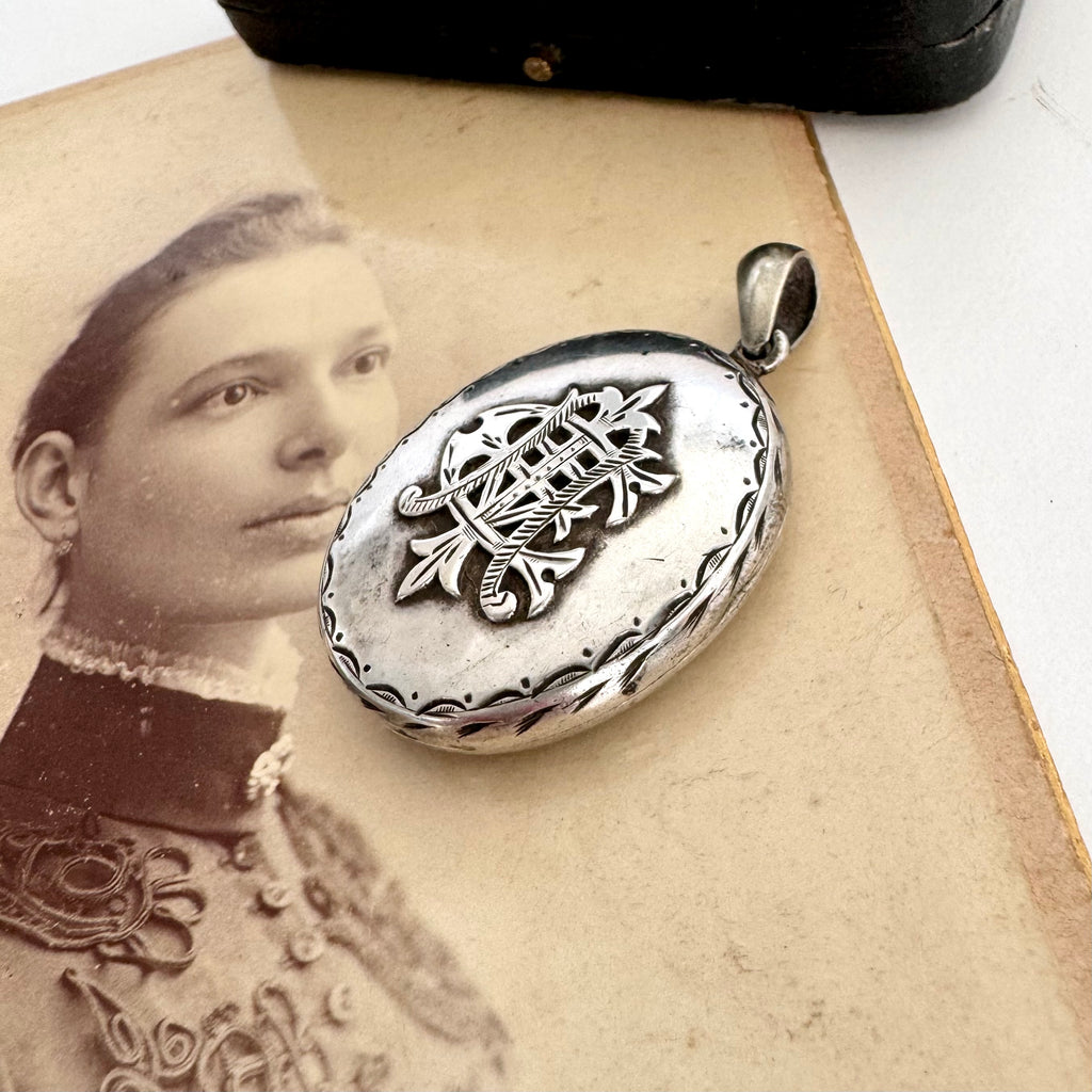 Vonk Jewellery Victorian silver Amity, Eternity and Infinity locket on an antique photo of a woman
