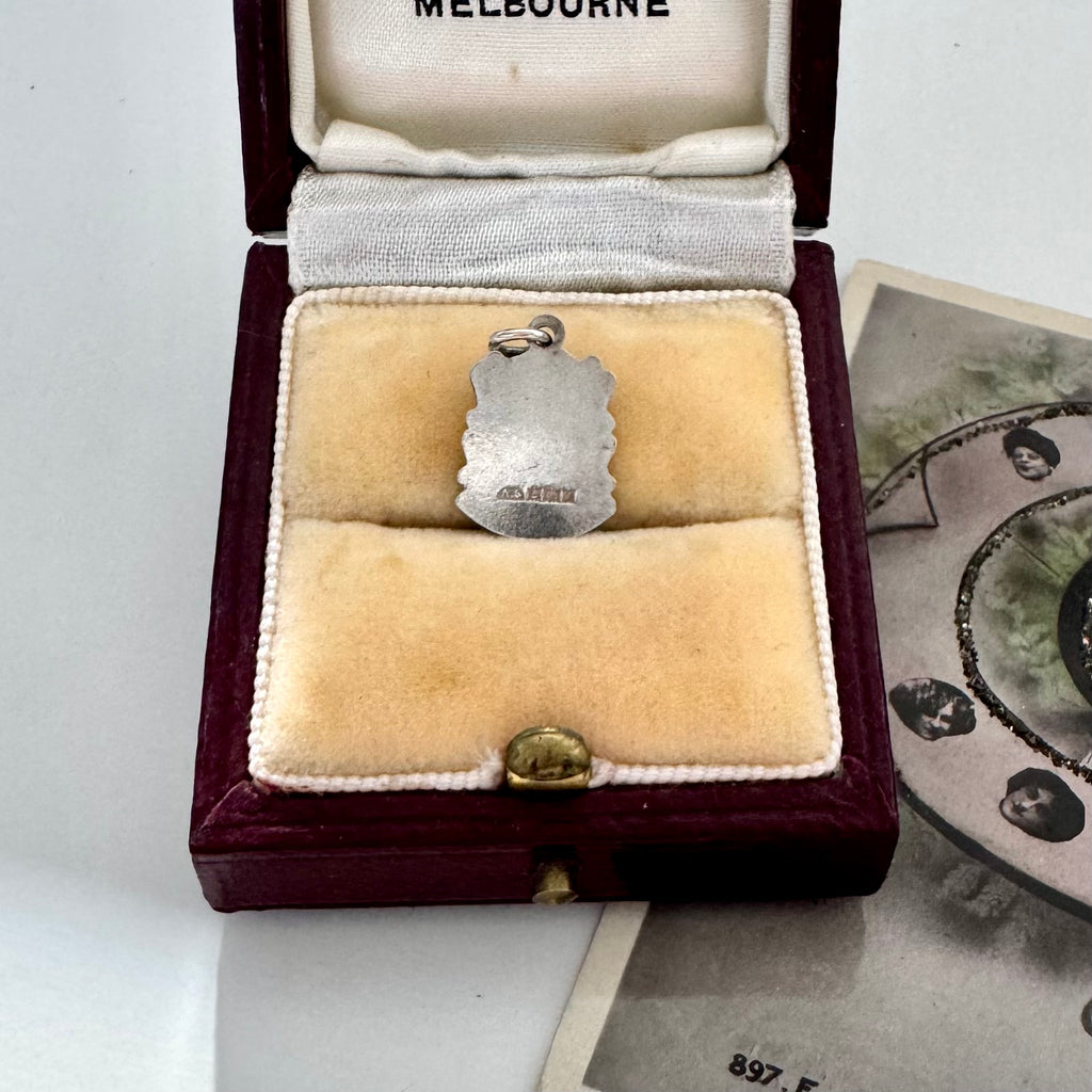 Vintage London silver coat of arms charm in a jewellery box