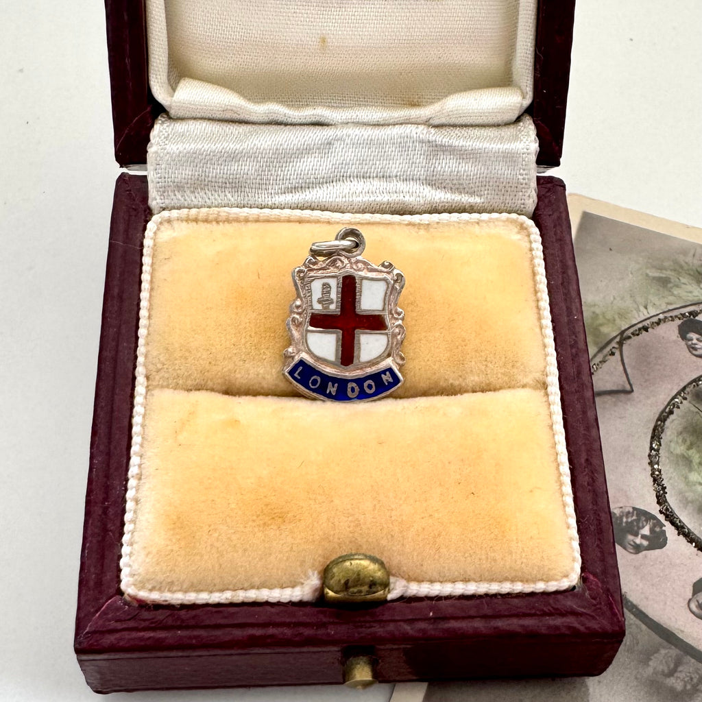 Vintage London silver coat of arms charm in a jewellery box