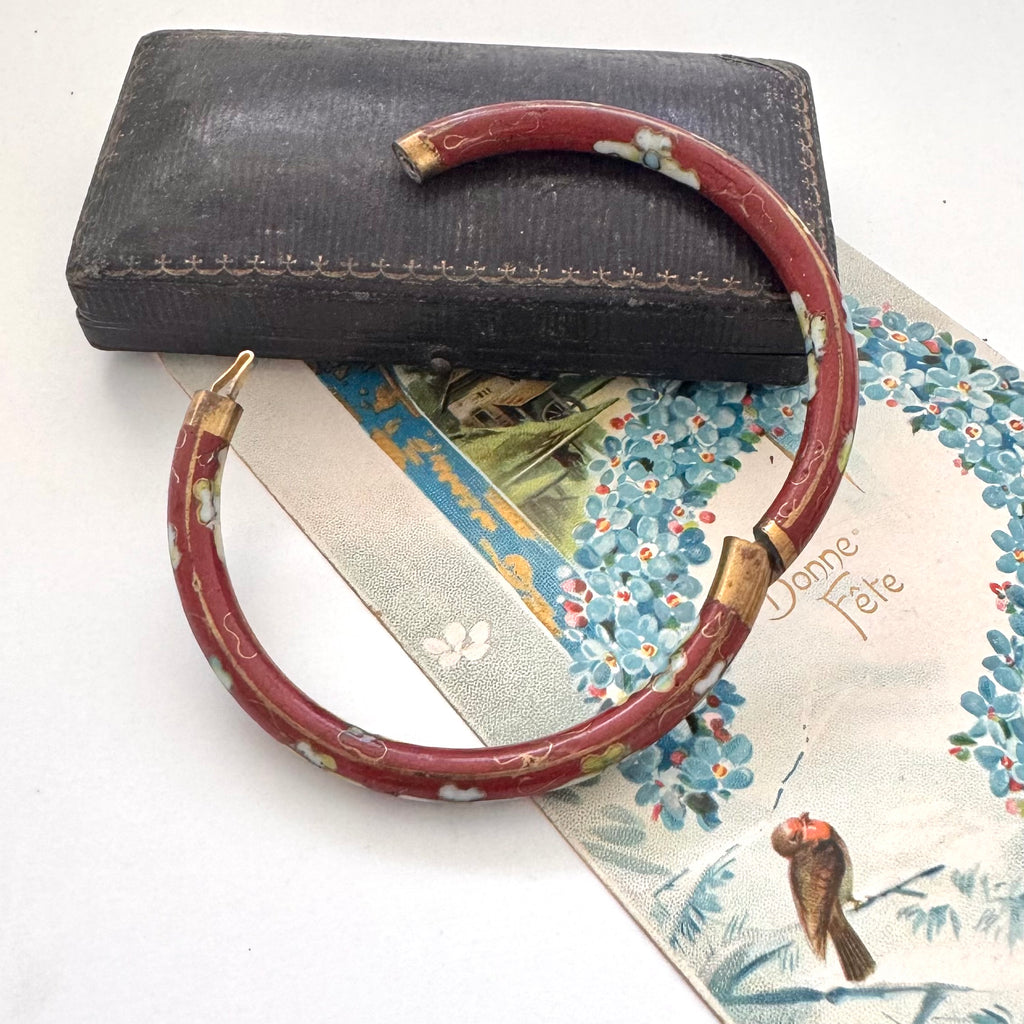 Vintage brown cloisonne bangle on an old jewellery box and with a vintage Christmas card