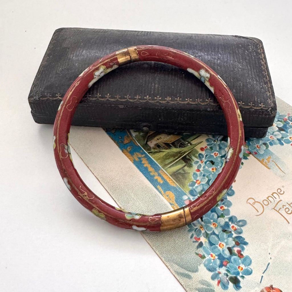 Vintage brown cloisonne bangle on an old jewellery box and with a vintage Christmas card