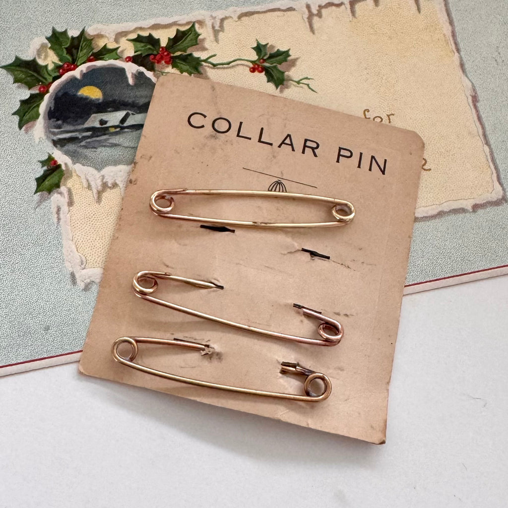Collar pins on a cardboard backing with 'Collar Pin' text, set against a decorative background.