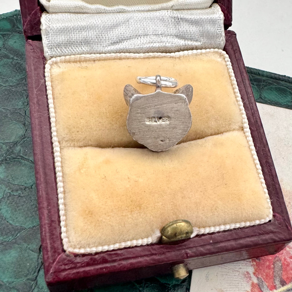 Silver fox head pendant/charm in a jewelry box with 'SILVER' engraved on it.