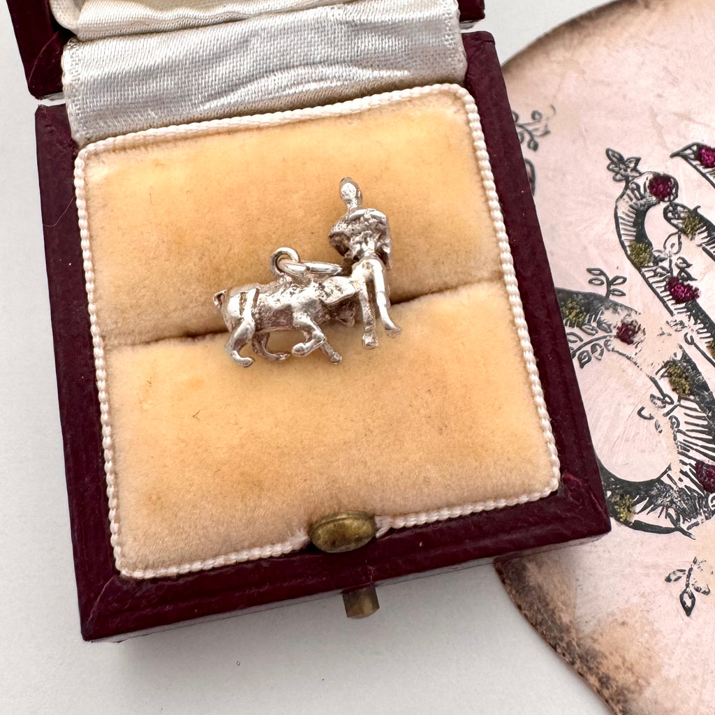 Vintage silver bullfighter charm on a jewellery box