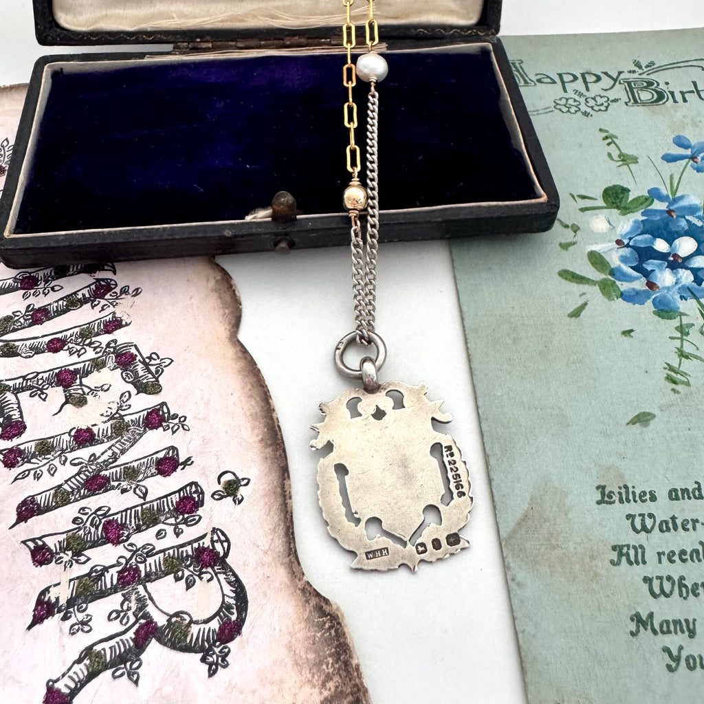 Vonk Jewellery 1898 sterling silver watch fob necklace with a vintage postcard and jewellery box