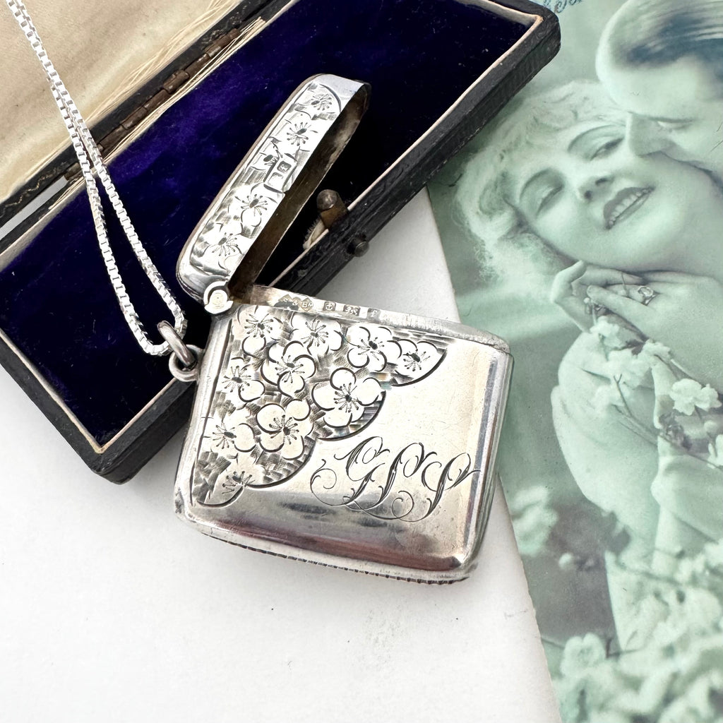 Vonk Jewellery 1905 antique vesta case necklace on a vintage postcard