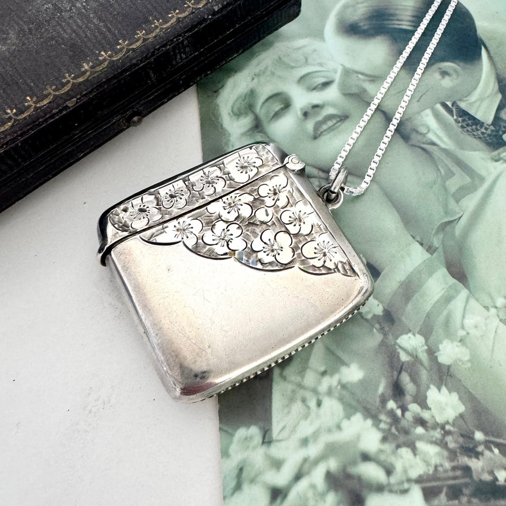 Vonk Jewellery 1905 antique vesta case necklace on a vintage postcard