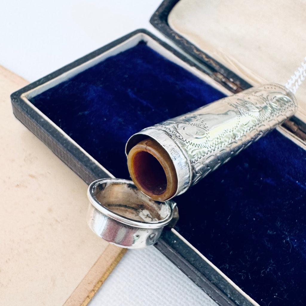 Vonk Jewellery 1915 sterling silver cheroot case and holder necklace on an antique photograph and vintage jewellery box