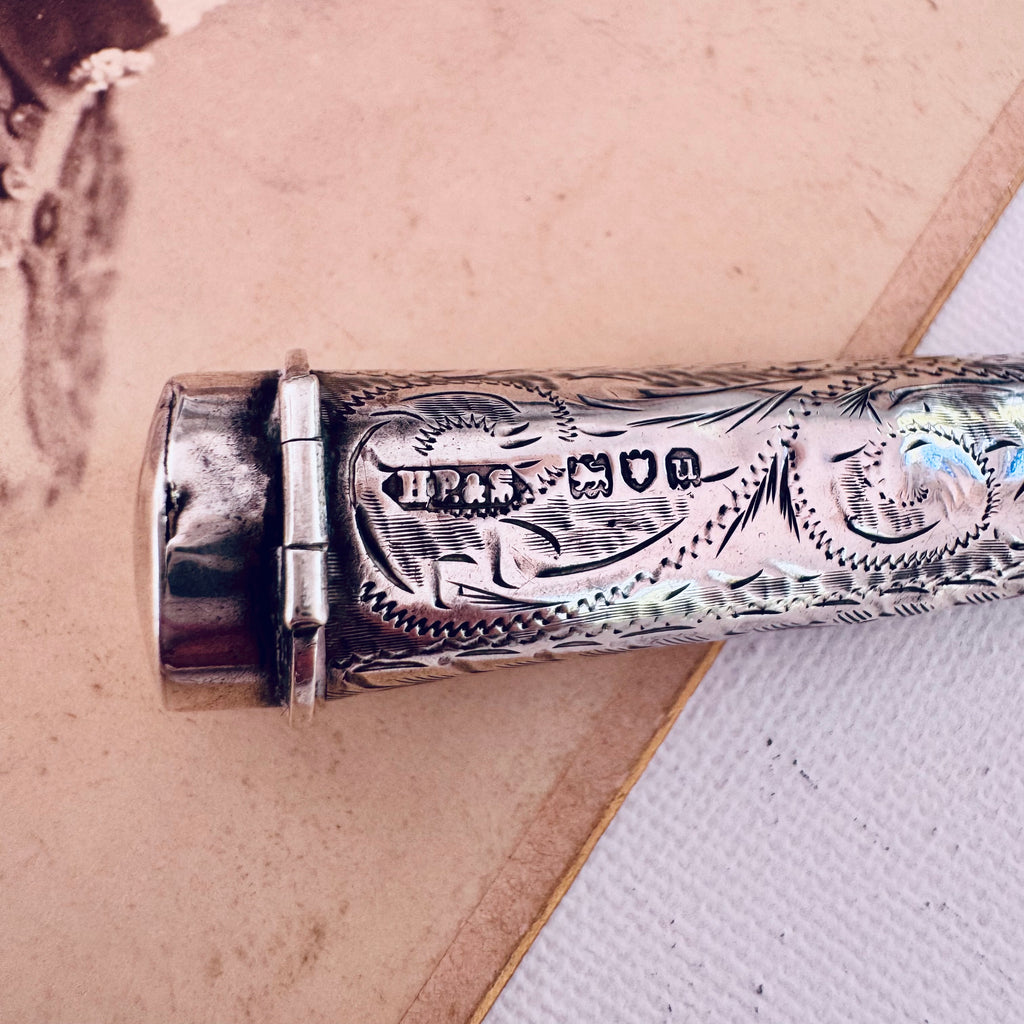 Vonk Jewellery 1915 sterling silver cheroot holder necklace on an antique photograph. A close up showing the hallmarks