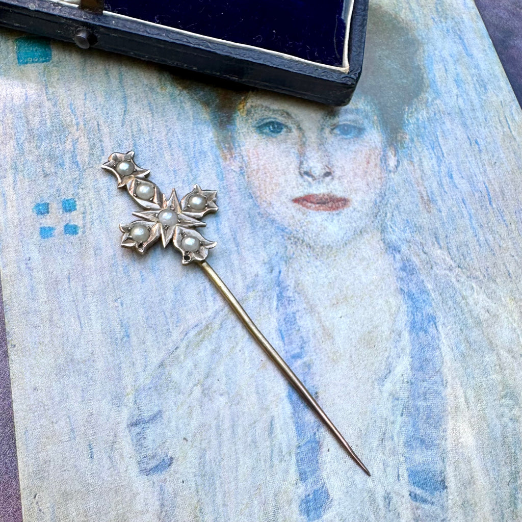Vonk Jewellery Aronsons 9ct gold and pearl crucifix stick pin on a vintage postcard and with a vintage jewellery box