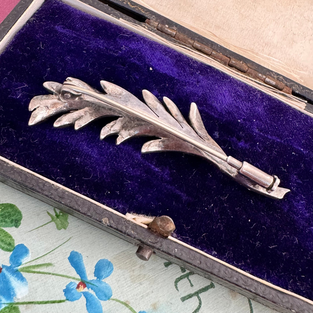 Vonk Jewellery French marcasite leaf brooch with trombone clasp on a vintage postcard and with a vintage jewellery box
