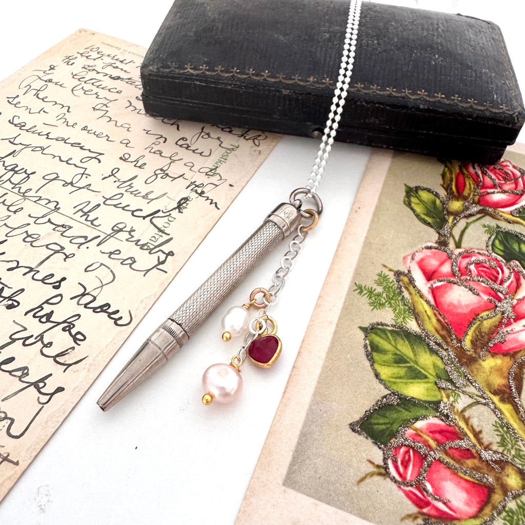 Vonk Jewellery Art Deco propelling pencil charm necklace with a vintage postcard and jewellery box