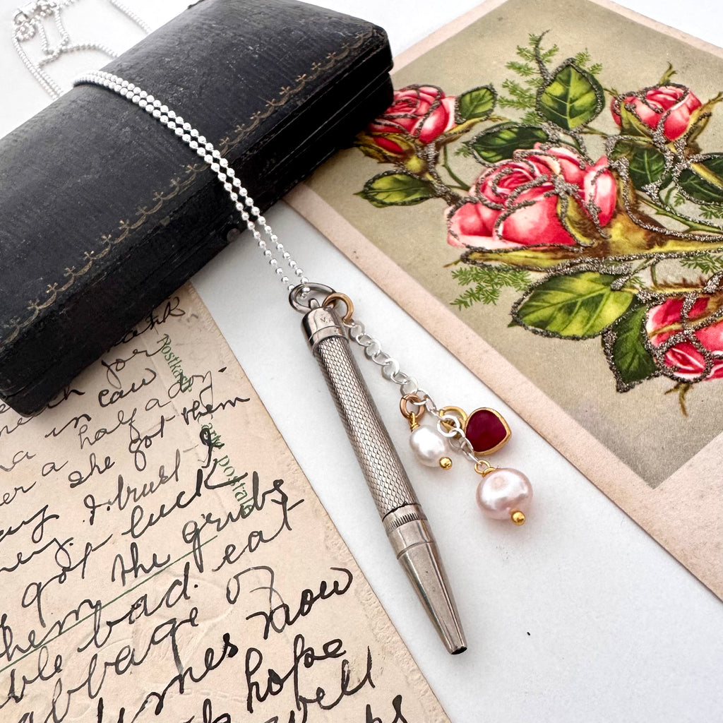Vonk Jewellery Art Deco propelling pencil charm necklace with a vintage postcard and jewellery box