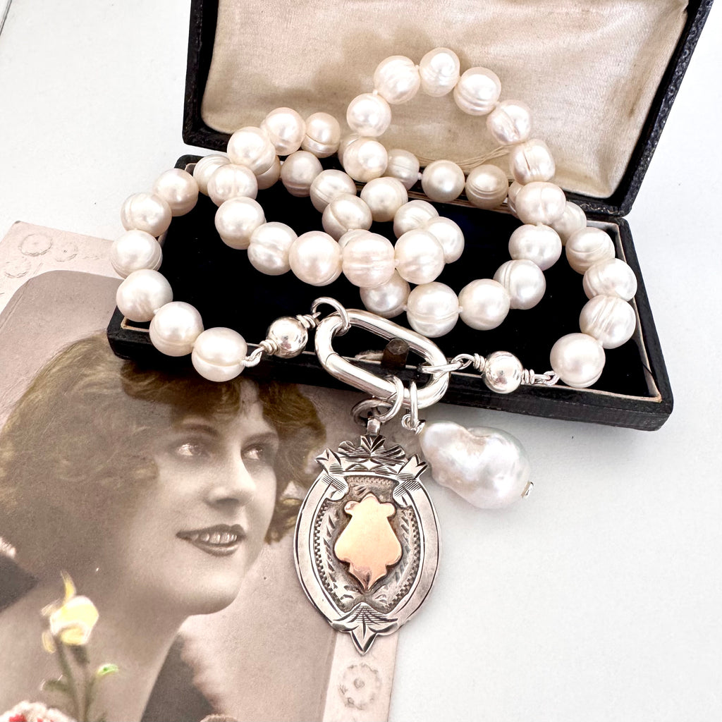 Vonk Jewellery 1931 watch fob and pearl necklace on a vintage postcard and vintage jewellery box