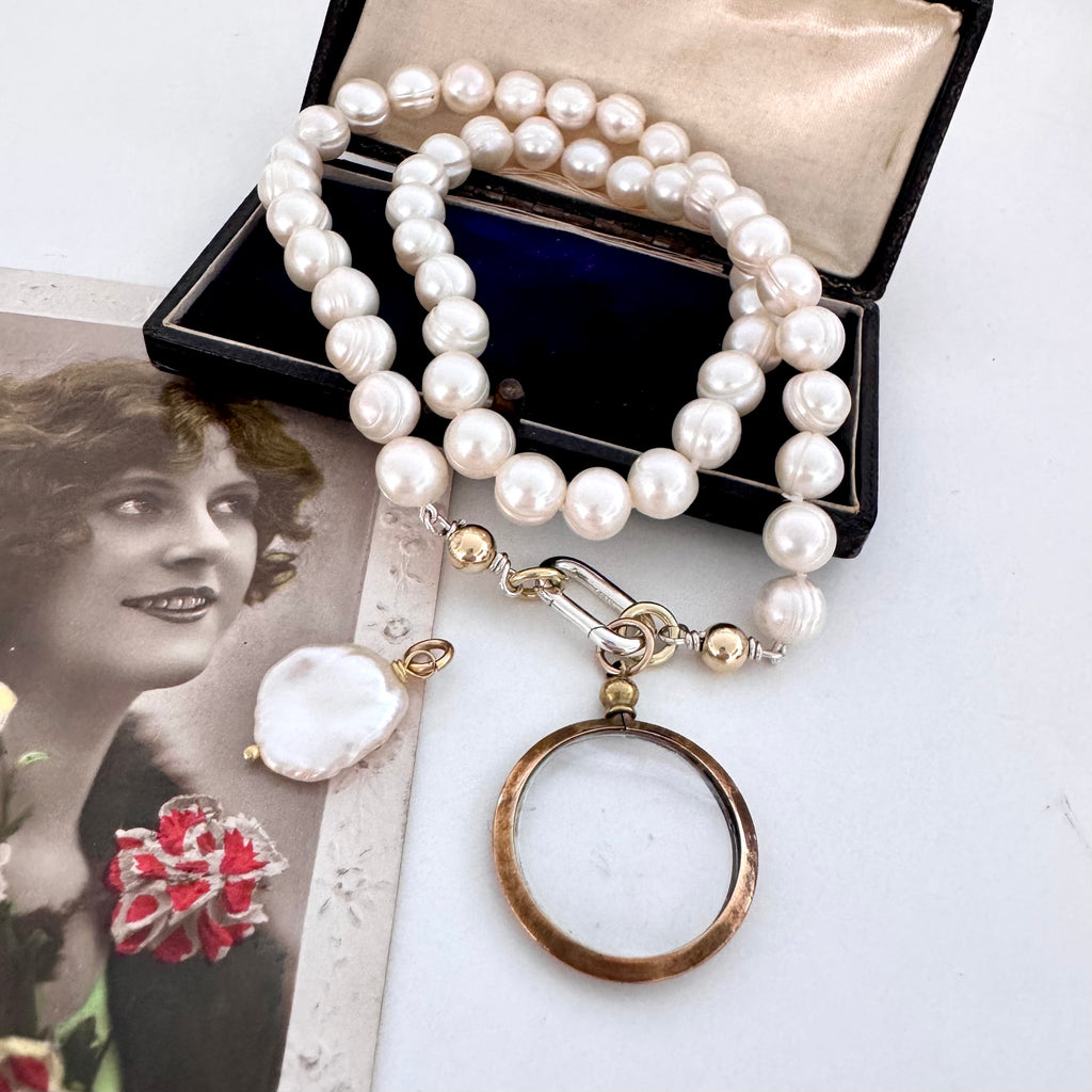 Vonk Jewellery antique gold tone locket pearl necklace on vintage postcards and a vintage box