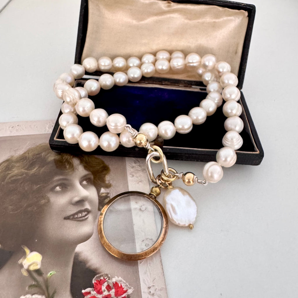 Vonk Jewellery antique gold tone locket pearl necklace on vintage postcards and a vintage box