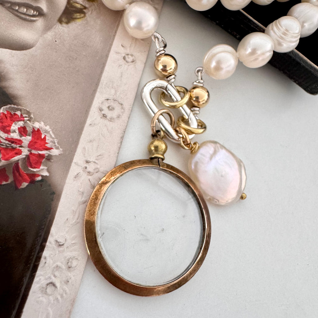 Vonk Jewellery antique gold tone locket pearl necklace on vintage postcards and a vintage box