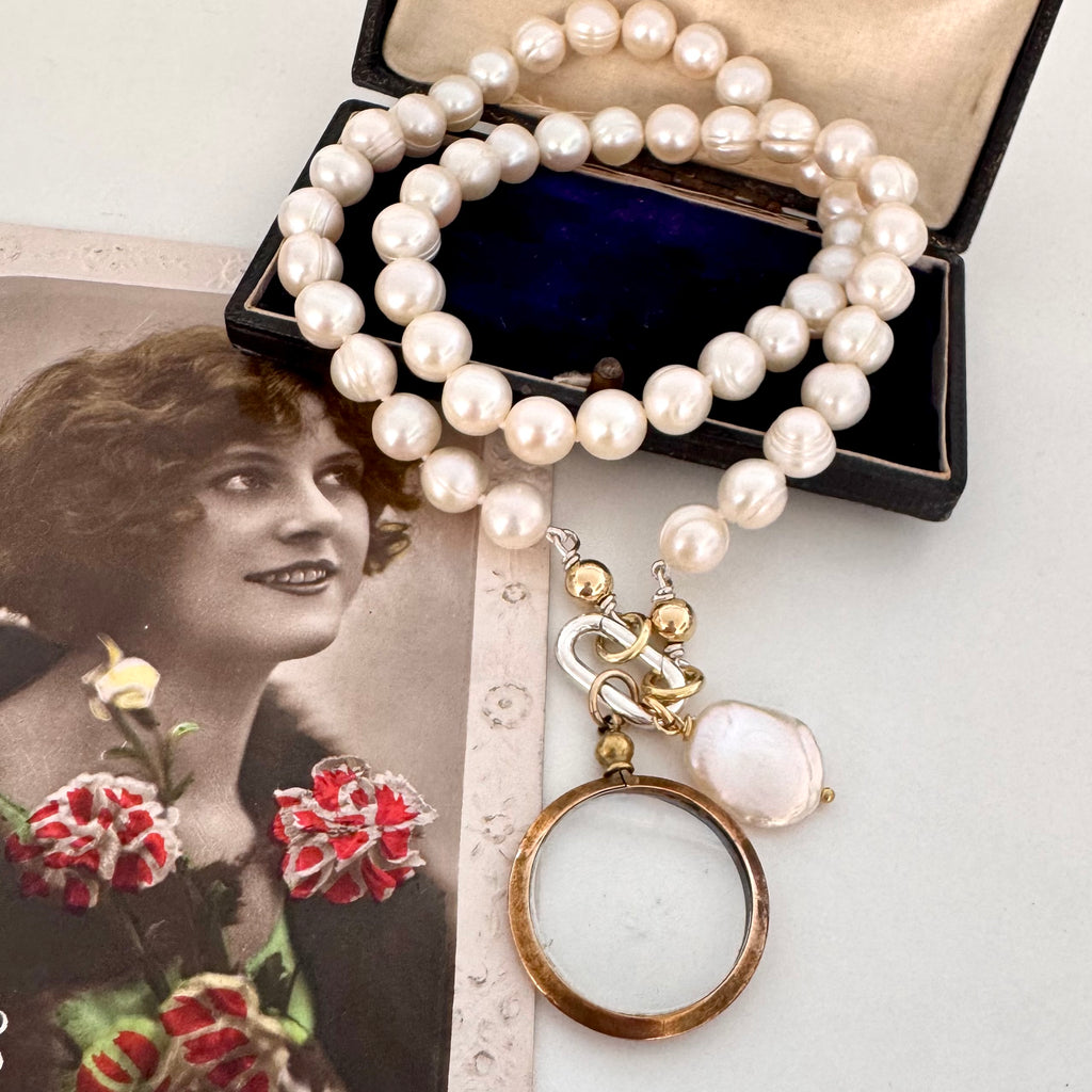 Vonk Jewellery antique gold tone locket pearl necklace on vintage postcards and a vintage box