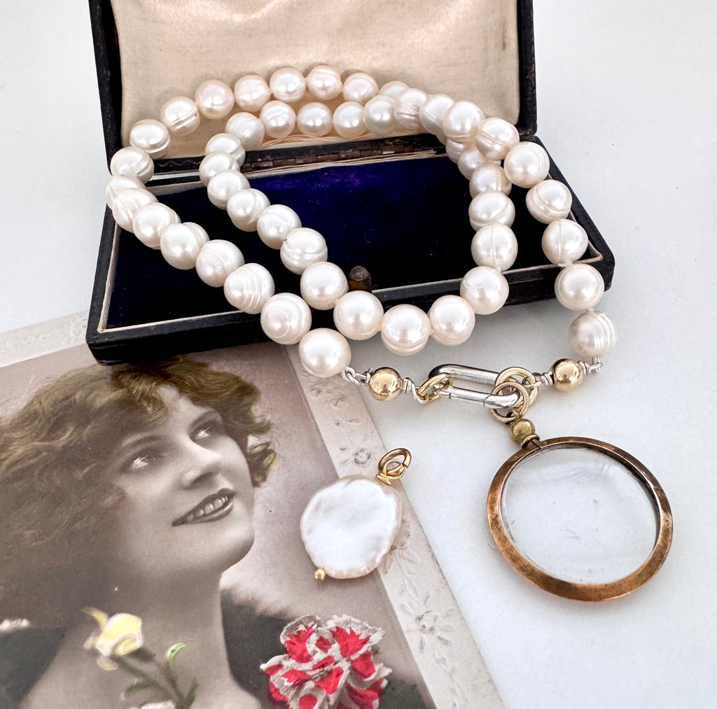 Vonk Jewellery antique gold tone locket pearl necklace on vintage postcards and a vintage box