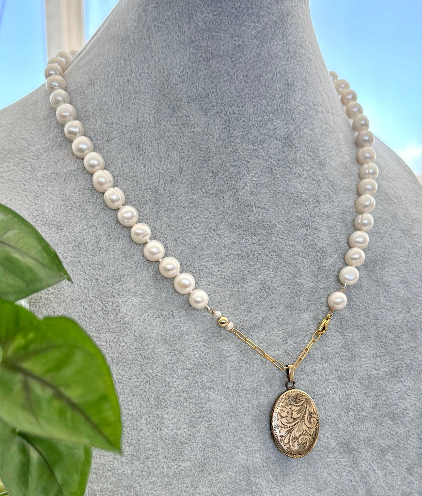 Vonk Jewellery rolled gold vintage locket and pearl necklace on a vintage jewellery box and vintage postcards