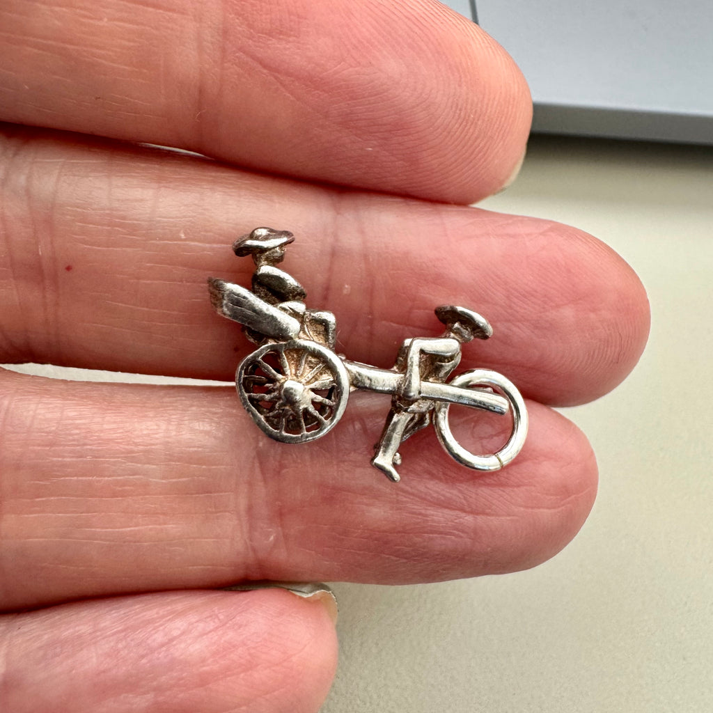 Vonk Jewellery vintage sterling silver rickshaw charm on a woman's hand