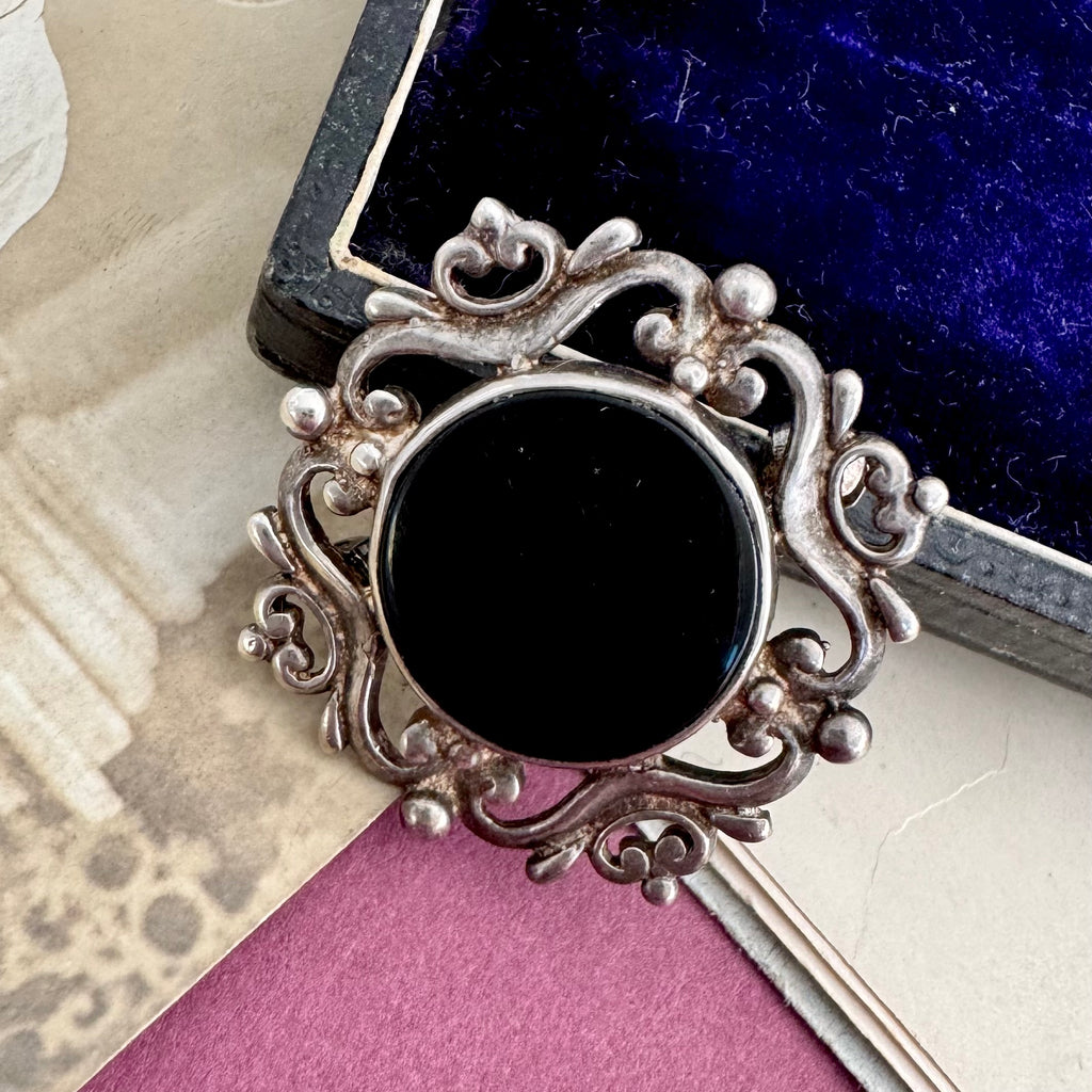 Vonk Jewellery sterling silver and black onyx brooch with a vintage postcard and jewellery box