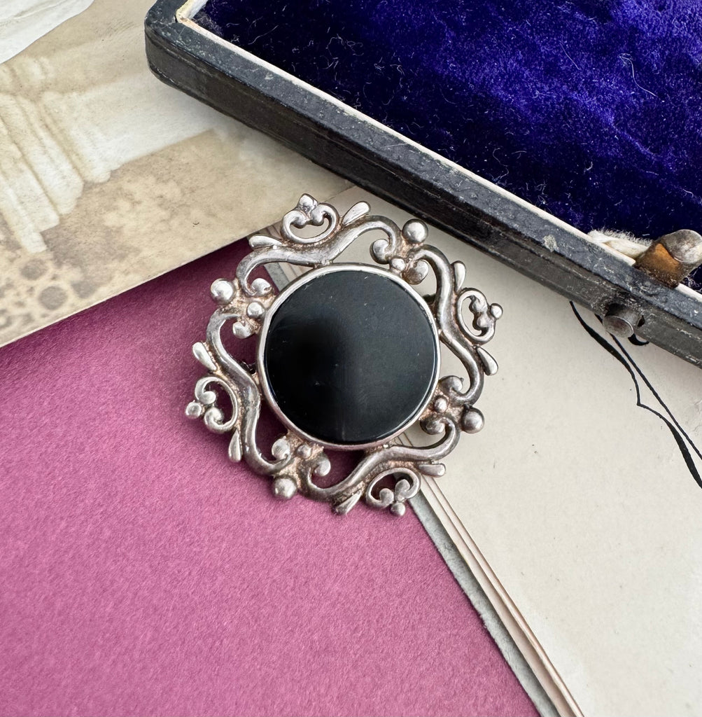 Vonk Jewellery sterling silver and black onyx brooch with a vintage postcard and jewellery box