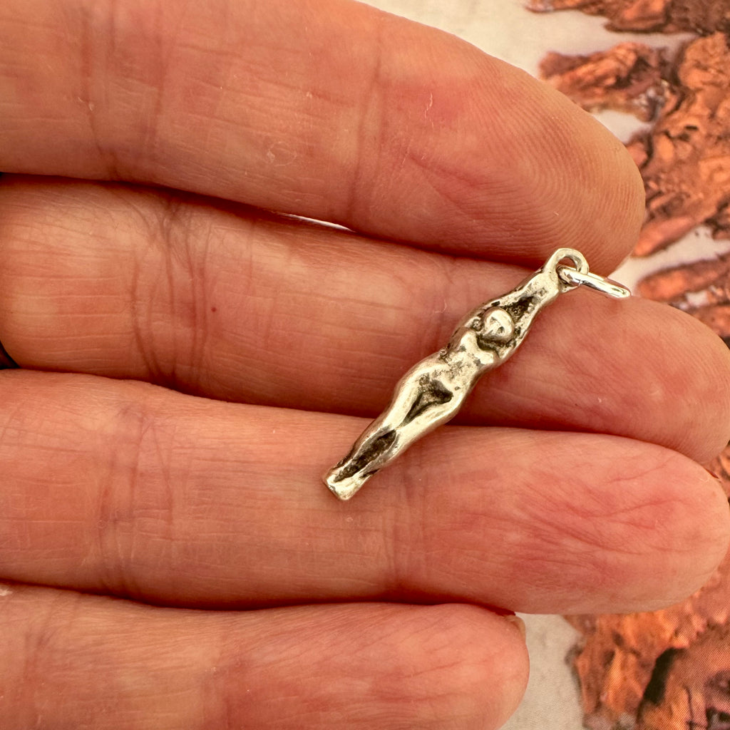 Vonk Jewellery vintage female swimmer or diver sterling silver charm on someones fingers