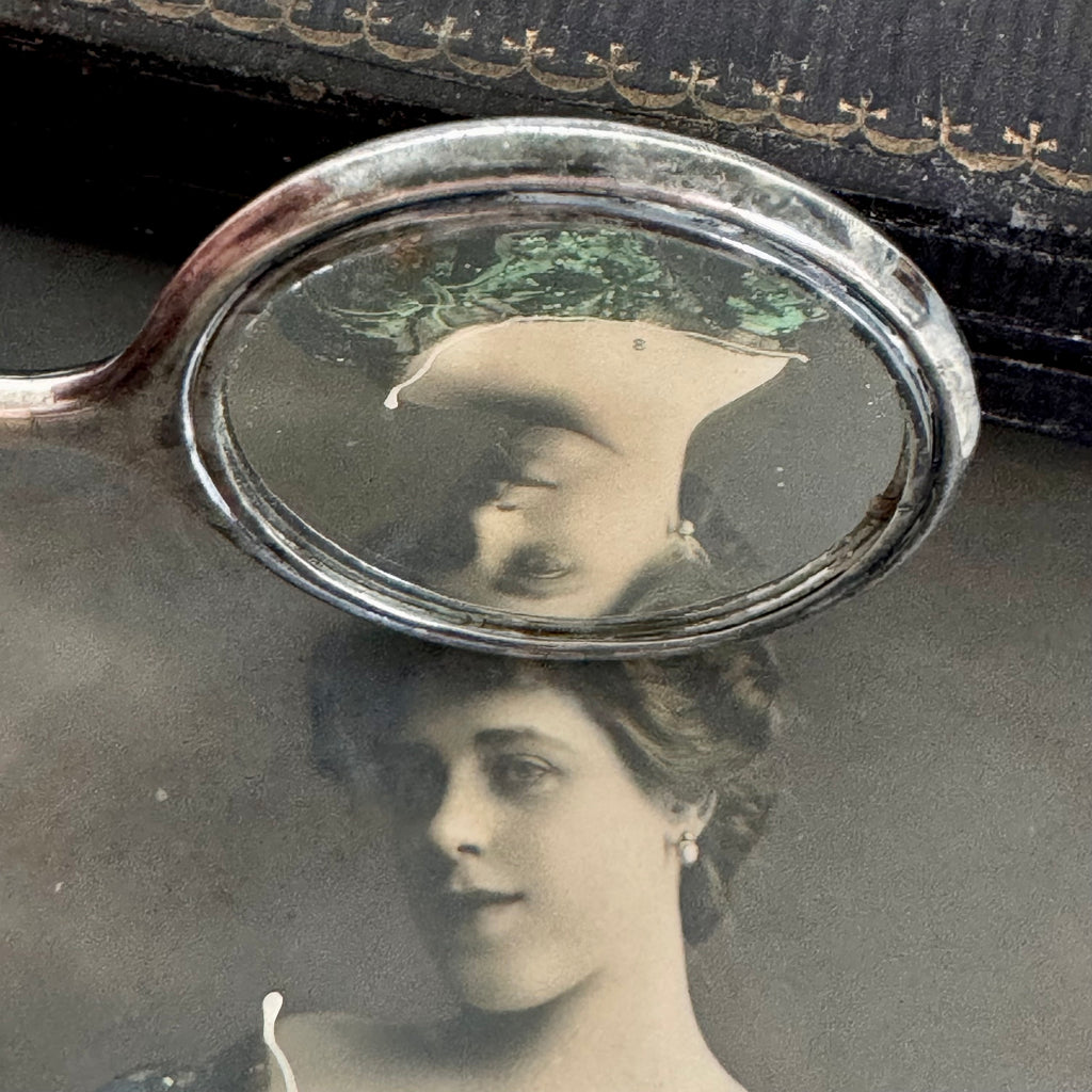 Vonk jewellery antique sterling silver hand mirror necklace on an antique box and with vintage postcards of a woman