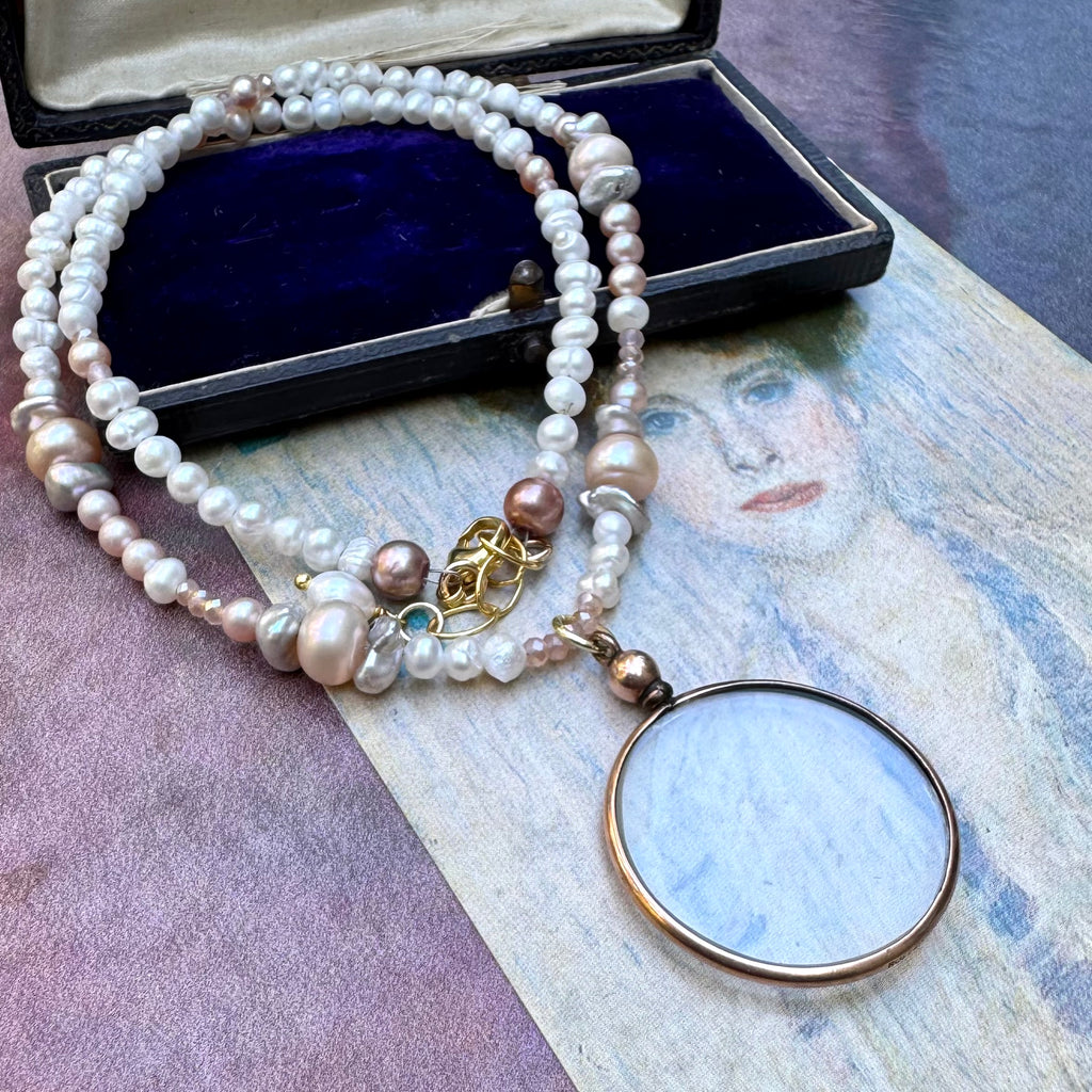 Vonk jewellery rolled gold double sided photo locket on a vintage postcard and with a vintage jewellery box